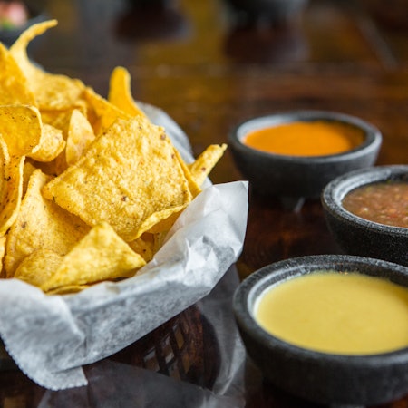 Corn chips with queso and salsa