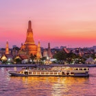 A ferry passes Wat Arun at twilight in Bangkok.
1057166794
Thailand, Cruise - Vacation, Temple - Building, Chao Phraya Rive, Chao Phraya River, Buddhism, East Asian Culture, Stupa, Night, Landscape - Scenery, Twilight, Community, Water, Vacations, Capital - Architectural Feature, Nature, Travel, Tourist, Dinner, Thai Culture, Business Travel, Landscaped, River, Urban Skyline, Waterfront, Wat Arun, Backgrounds, Scenics - Nature, City, Cityscape, Architecture, Sunset, Famous Place, International Landmark, No People, Cruise Ship, Photography, Travel Destinations, Horizontal, History, Spirituality, Bangkok, Local Landmark, Wat, Dusk, Passenger Craft, Asia, Bangkok Province, Cultures, Journey, Religion, Arranging, Outdoors, Pagoda