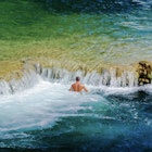 Man standing in water near small waterfalls in Krka National Park
Getty, RFC, People Cold Temperature Motion Adventure Enjoyment Lifestyles Horizontal Outdoors Swimming Rippled Water Winter Wave Surf Reflection Sea Croatia Turquoise Colored One Person Color Image Splashing Leisure Activity Photography Zadar Power in Nature 2015, Back, Nature, Outdoors, Person, Photography, Rock, Sea, Sea Waves, Summer, Swimming, Swimwear, Water
Man standing in water near small waterfalls in Krka National Park