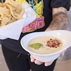 Kerby Lane, queso shirt with dish of queso