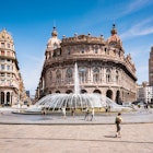 Genoa, Liguria / Italy - 07 08 2018: View of Piazza Raffaele de Ferrari, in the middle Palazzo della Nuova Borsa -  country stock exchange.   License Type: media  Download Time: 2023-08-31T01:12:16.000Z  User: mvm_lonelyplanet  Is Editorial: Yes  purchase_order:   