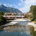 Index, WA, USA - September 08, 2021; The Empire Builder long distance Amtrak train behind a locomotive in 50th anniversary paint scheme crosses the North Fork Skykomish River in Index, License Type: media, Download Time: 2025-02-14T12:24:37.000Z, User: clairenaylor, Editorial: true, purchase_order: 65050 - Digital Destinations and Articles, job: Online editorial, client: Best trains USA, other: Claire Naylor