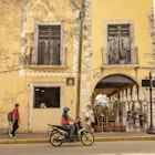 VALLADOLID, MEXICO - August 2022: Traditional mexican style colorful houses in Valladolid town, Yucatan, Mexico
2236005939
adventure,  america,  ancient,  architecture,  avenue,  beautiful,  building,  cityscape,  colonial,  color,  colorful,  colors,  culture,  destination,  european,  facade,  historic,  historical,  history,  house,  landscape,  lawn,  maya,  mexican,  mexico,  narrow,  old,  outside,  peninsula,  place,  religion,  road,  street,  structure,  tourism,  town,  traditional,  traffic,  urban,  valladolid,  vintage,  yucatan,  colonial houses,  colorful houses,  mexican style,  south east,  street life,  travel mexico,  valladolid town,  Backpack,  Car,  City,  Handbag,  Helmet,  Machine,  Motor,  Motorcycle,  Neighborhood,  Outdoors,  Path,  Person,  Plant,  Road,  Shelter,  Shoe,  Street,  Traffic Light,  Urban,  Vehicle
VALLADOLID, MEXICO - August 2022: Traditional mexican style colorful houses in Valladolid town, Yucatan, Mexico