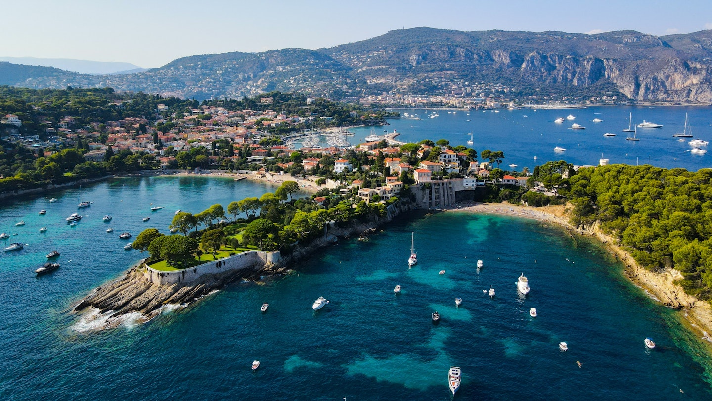 Aerial drone view of Saint-Jean-Cap-Ferrat, French Riviera (Côte d'Azur), France. Birds Eye view of the French Riviera resort town on Cap Ferrat cape with exclusive estates in a perched village., License Type: media, Download Time: 2025-02-26T18:30:24.000Z, User: katelyn.perry_lonelyplanet, Editorial: false, purchase_order: 65050 - Digital Destinations and Articles, job: wip, client: wip, other: katelyn perry